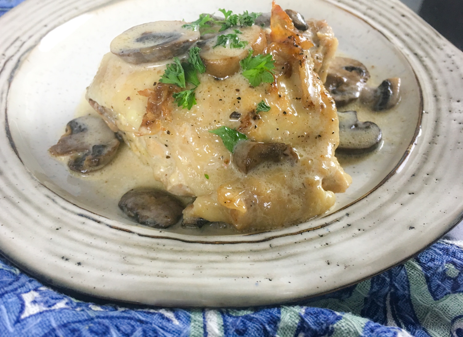 keto chicken thighs with creamy mushroom sauce in skillet