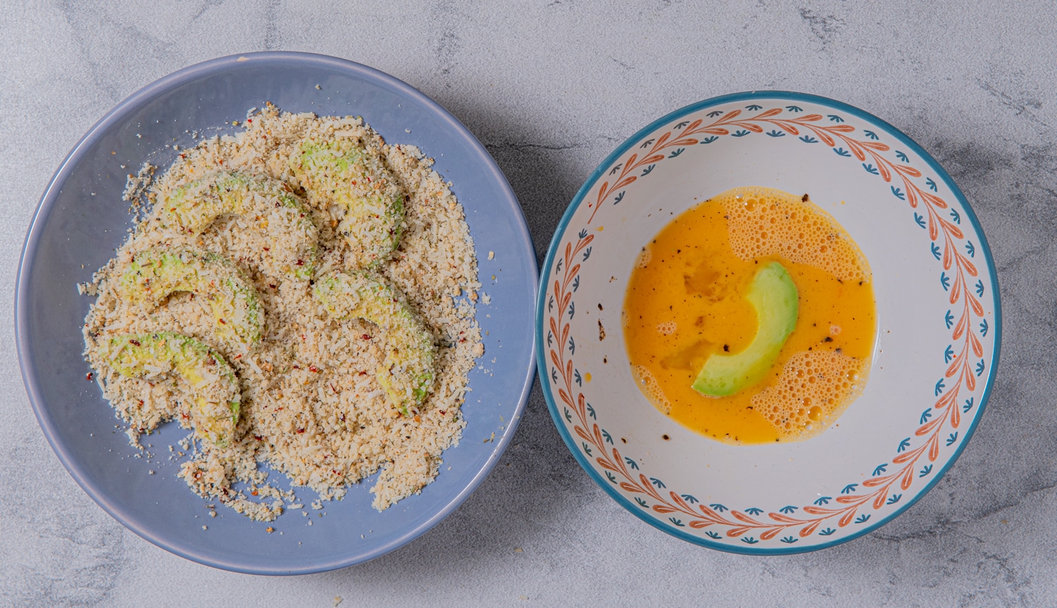 Avocado wedges dipped in egg mixture and coated with parmesan almond flour breading before baking