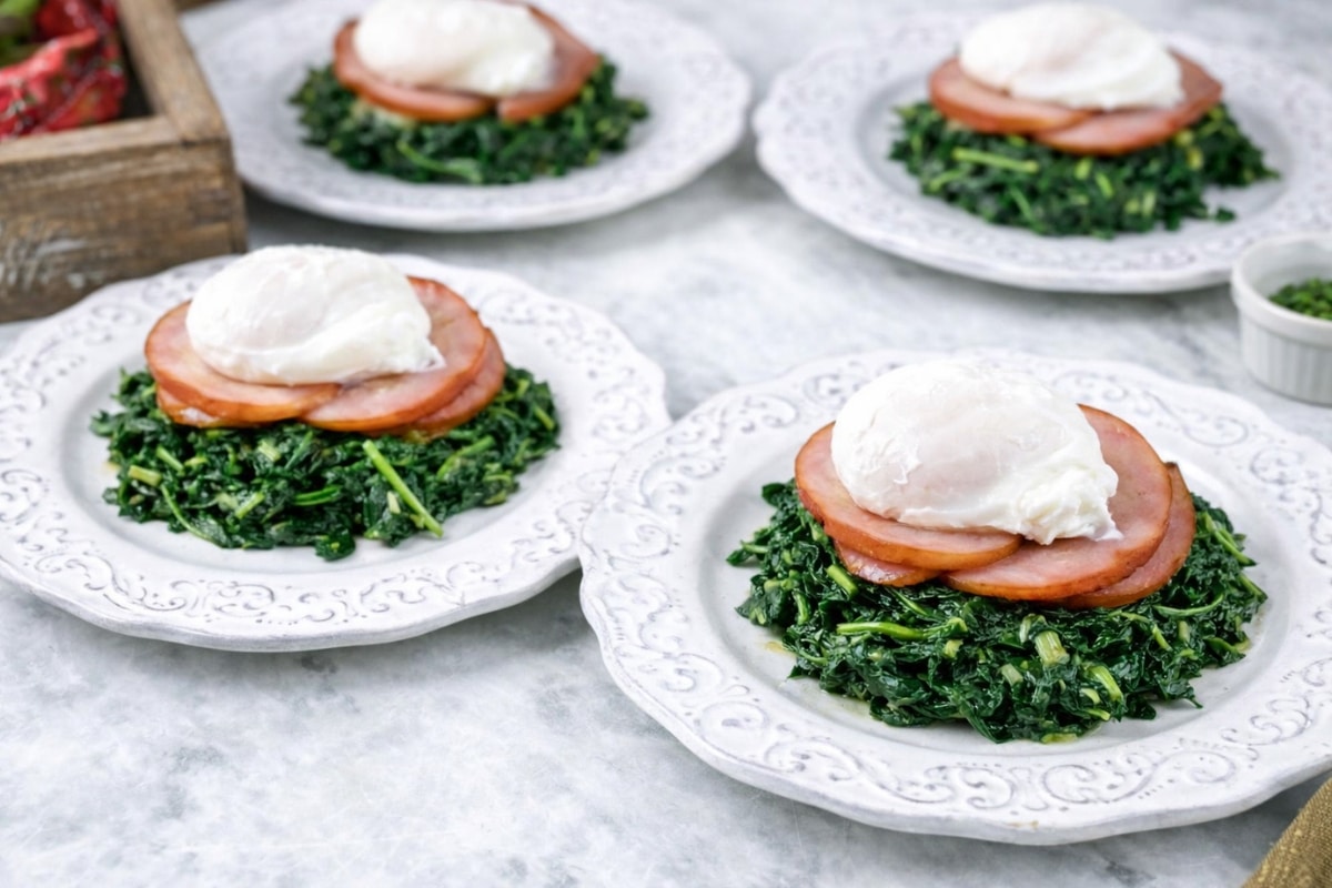 4 portions of keto eggs benedict spinach canadian bacon poached egg