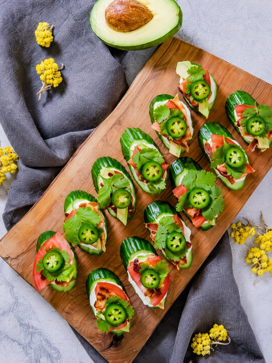 keto cucumber BLT bites with avocado tomato bacon cilantro and jalapeño slices